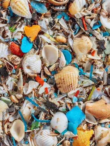 Top view of micro-plastics among seashells