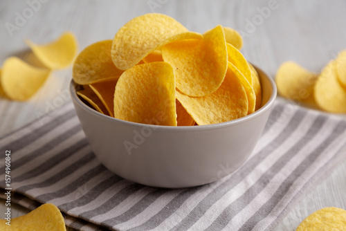 Potato Chips in a Bowl, side view. Close-up.