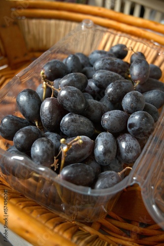 Wallpaper Mural Blue grape in transparent plastic box close up. Torontodigital.ca