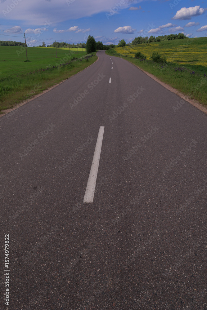 Obraz premium Highway wide road, transport and blue sky with clouds on a summer day
