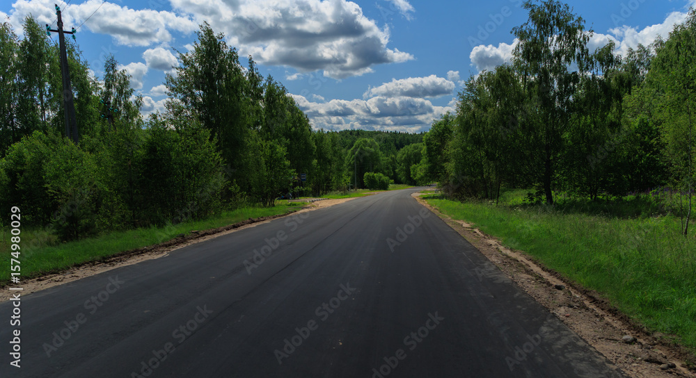 Fototapeta premium Highway wide road, transport and blue sky on a summer day