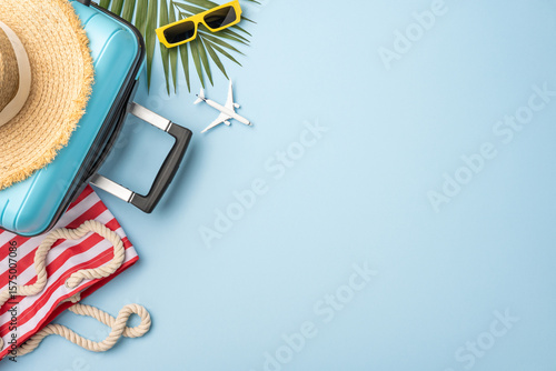 Tablou pe pânză Travel essentials such as a suitcase and summer accessories with a tropical vaca