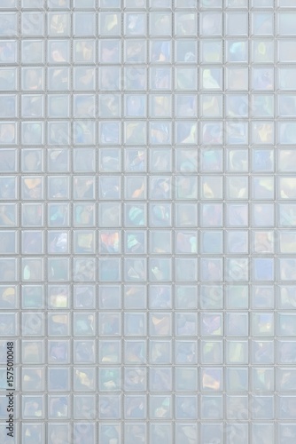 Elegant iridescent texture of glass mosaic tiles with soft pastel reflections. Elegant, minimalistic and laconic background for creative projects and digital art.