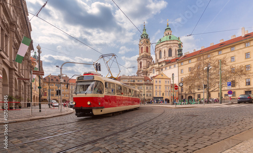 Photography Tram Near Saint Nicholas Church in Prague, Czech Republic