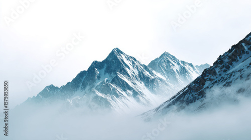 Wallpaper Mural Mountain range shrouded in mist with snow covered peaks, dramatic landscape, tranquil and serene atmosphere, cold winter scene, natural beauty Torontodigital.ca