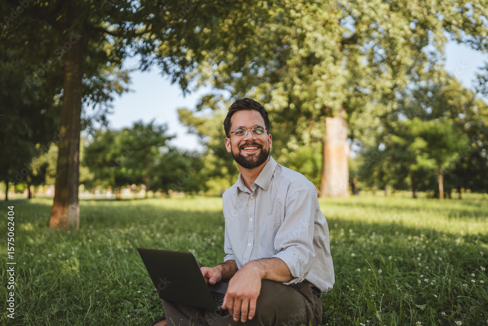 businessman sit on grass in nature and use laptop for work or leisure businessman sit on grass in nature and use laptop for work or leisure