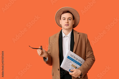 Young man in hat, coat and ...