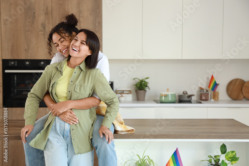 Young lesbian couple huggin...