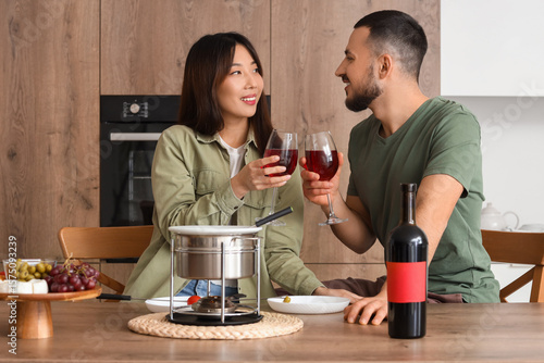 Happy young couple toasting...