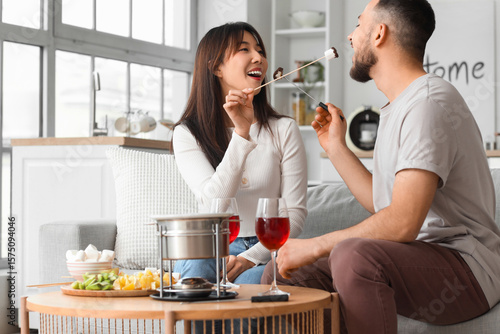 Young happy couple with gla...