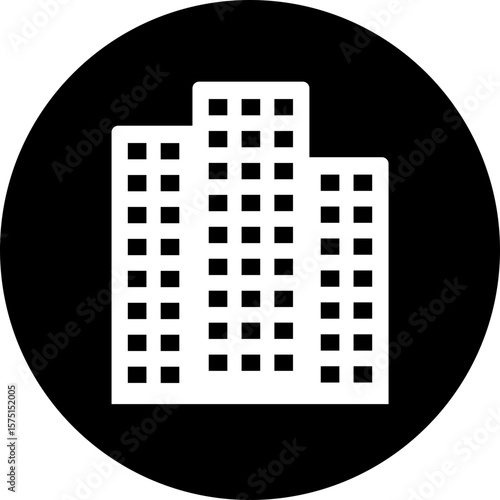 High rise building icon silhouette in circle