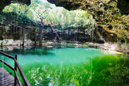 Wooden walkway around the famous X'Canche cenote, with a natural pool of fresh water in a limestone cavern near Ek Balam,near Valladolid,Yucatan,Mexico