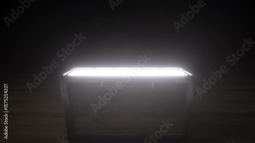 Glowing wooden treasure chest opens in dark room with intense white light bursting outward, for product demo