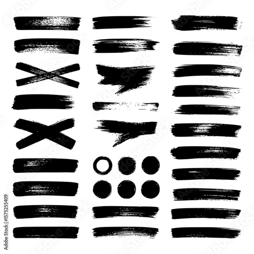 Collection of diverse grunge black ink brush strokes and shapes isolated