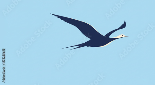 A single dark bird soars gracefully against a bright, clear blue sky.