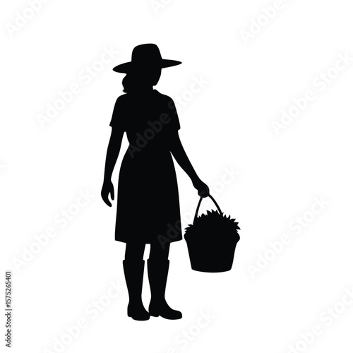 Silhouette of Farmer Holding A Bucket Filled With Harvested Plants