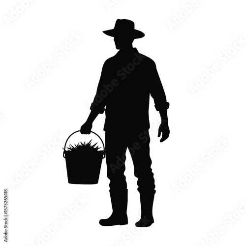 Silhouette of Farmer Holding A Bucket Filled With Harvested Plants