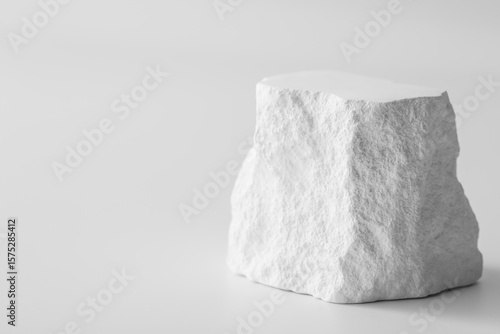 Uneven White Rock on Minimalist Background in Soft Lighting