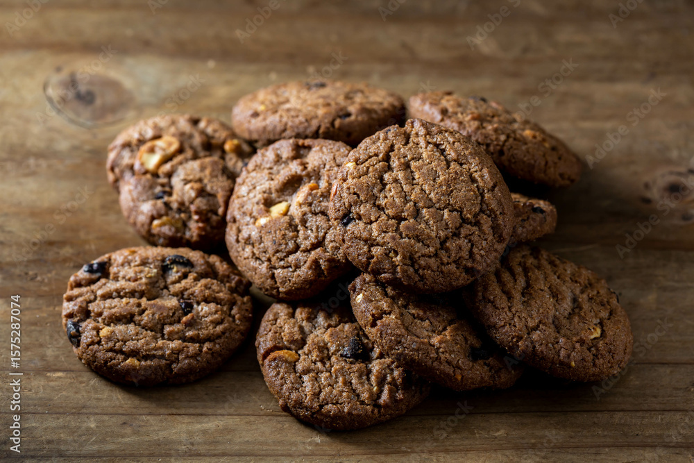 Freshly Baked Chocolate Cookies on Rustic Wooden Surface Freshly Baked Chocolate Cookies on Rustic Wooden Surface