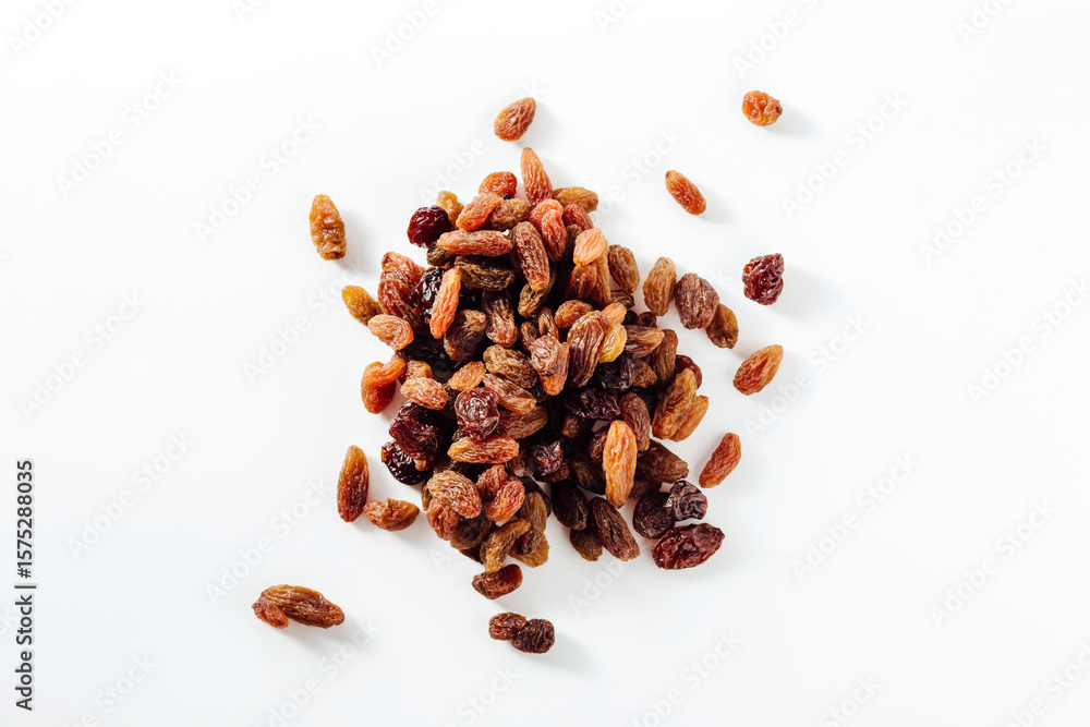 Obraz premium Assorted Dried Raisins in Various Shades on White Background