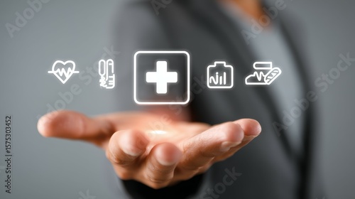 Hand Holding Healthcare Icons with Heartbeat, Syringe, Cross, and Chart Symbols