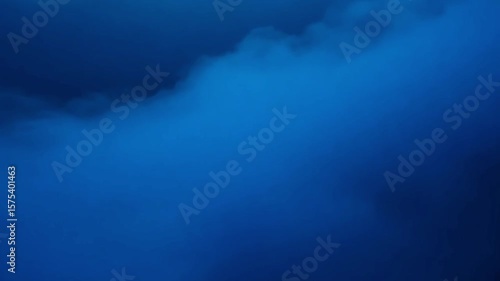 Deep blue abstract cloudscape with ethereal foggy atmosphere,