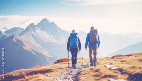 Photograph of people hiking up a mountain and enjoying the beautiful panoramic view of the high peak.