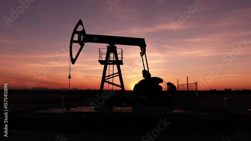 Pumping Dusk: Silhouette of Industry at Sunset