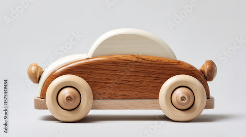 A photo of a wooden toy car on a clean white background