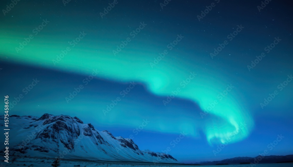 Naklejka premium Curving aurora borealis over snow-capped mountains