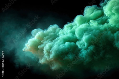 Green smoke cloud wispy edges and dense center against a dark background