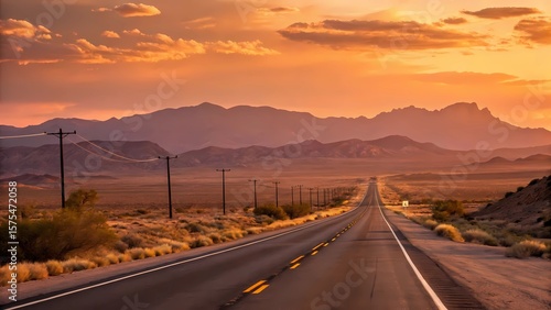 Fototapeta Naklejka Na Ścianę i Meble -  Desert highway road trip at sunset with mountains and orange sky scenic landscape photography travel usa