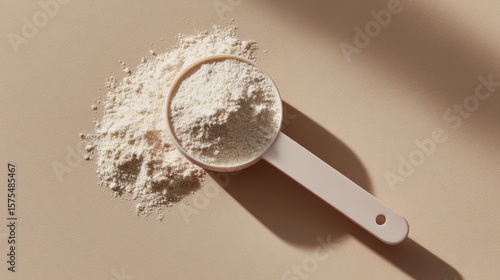 Ceramic measuring spoon with fine white powder collagen