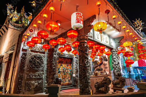 Night view of Choo Chay Keong Buddhist Temple on Armenian Street, beautifully illuminated and showcasing traditional architecture and spiritual ambiance in George Town.