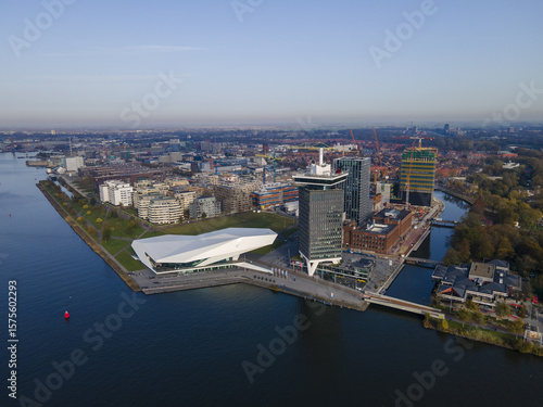 Aerial view of the ultramodern EYE Film Institute contrasting against the historic A'DAM Lookout tower and surrounding cityscape, Amsterdam, North Holland, Netherlands.