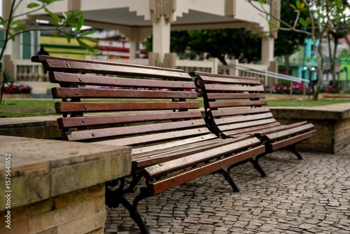 Fototapeta Naklejka Na Ścianę i Meble -  Wooden benches in a park setting.
