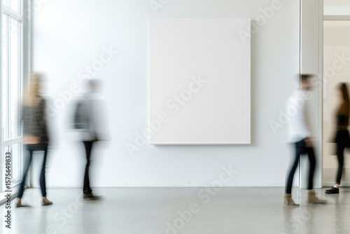 People walking past a blank canvas in a modern art gallery with soft lighting and a minimalist interior design