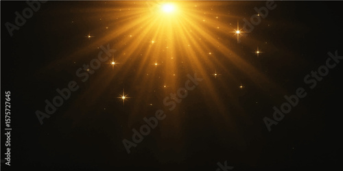 Glowing golden burst of light rays on abstract black background with sparkles