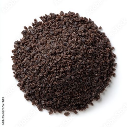 Pile of dark brown cookie crumbs or crushed oreos isolated on white background