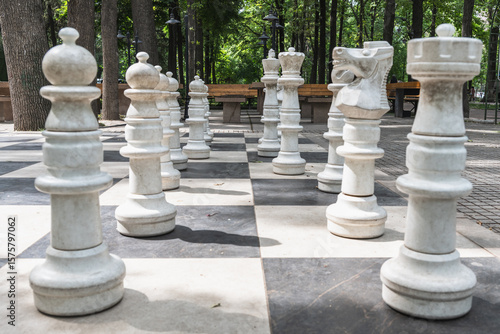 Bishkek, Kyrgyzstan - May 27, 2025: Giant chess pieces on a chessboard on Erkindik Boulevard in Bishkek.