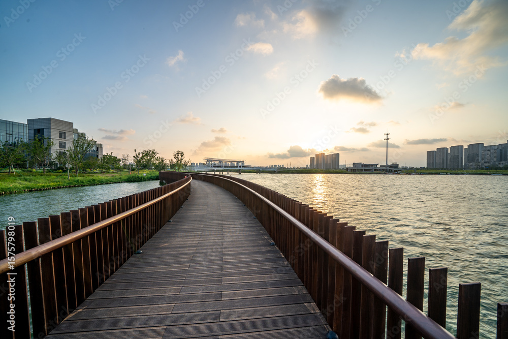 round walkway over lake with sunset round walkway over lake with sunset