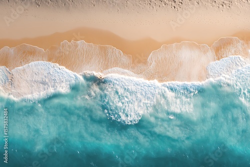 Aerial View of Ocean Waves Crashing on Sandy Beach