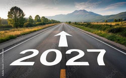 New year 2027 written on the road in the middle of asphalt road at sunset. Concept of planning , challenge,