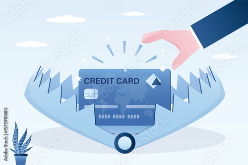 Customer hand reaching for credit card in animal trap. Finance and risk management. Credit financing bank bait, loan. Risks of getting trapped and getting into trouble.