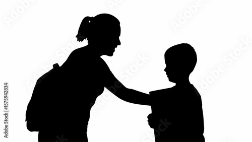 Silhouette of a woman with a backpack talking to a child holding a book in a black and white image format