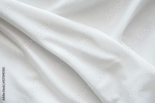 The texture of the bright white fabric is wavy and flowing, the wrinkles of the white stretch fabric.