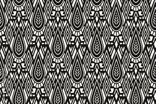 Black and white seamless pattern featuring stylized teardrop, paisley motifs within geometric shapes.