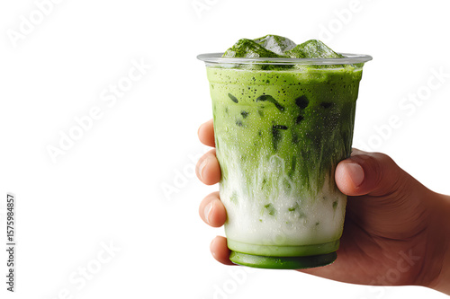  hand holding glass of iced matcha latte against a plain background. Japanese green tea beverage. isolated on transparent background with clipping path. For food menu design