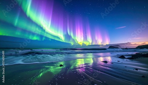 Spectacular Aurora Borealis Display Over Ocean Waves at Night