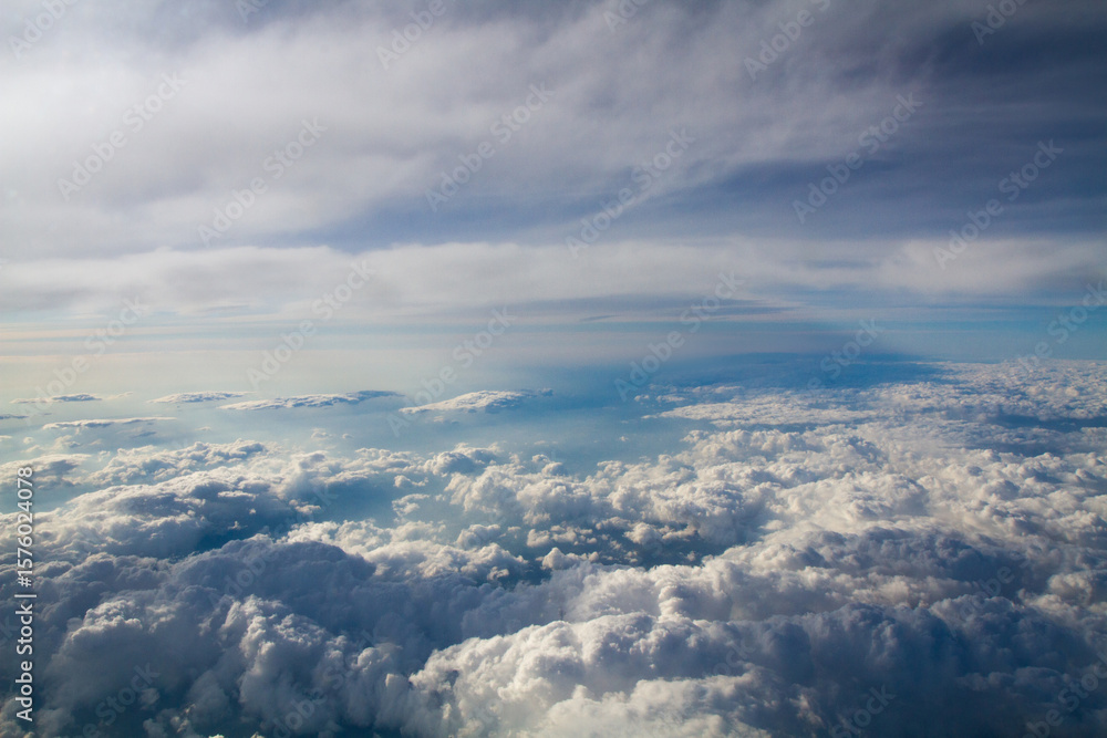 Naklejka premium beautiful thick clouds in the sky from the height of the plane